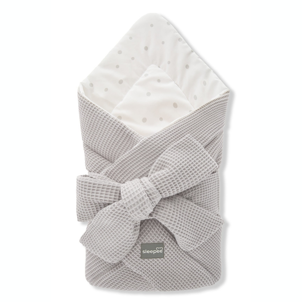 Sleepee Waffle Swaddle Blanket with adjustable bow tie and anti-allergic filling, providing comfort and security for newborns.