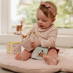 Little Dutch Set of Soft Cubes - Fairy Garden featuring colorful textures, sounds, and a soft floral mirror for sensory play.