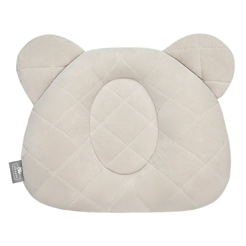 Sleepee Velvet Teddy Bear Pillow with indent for flat head prevention, matching velvet swaddle blankets for a stylish newborn set.